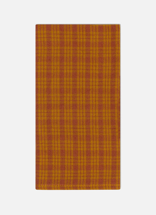 Plaid patterned fabric in orange on a white background