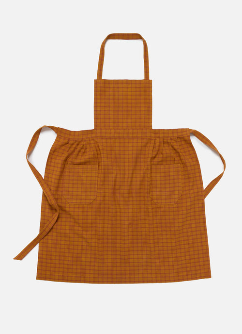 Orange checkered apron on a white background