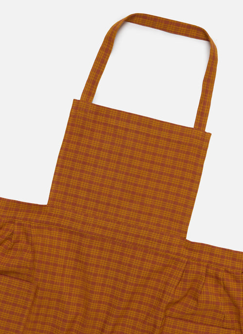 Orange checkered apron on a white background