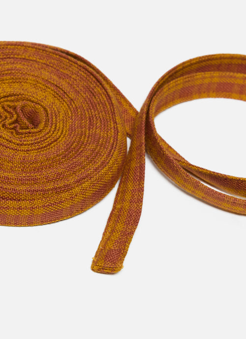 Orange plaid ribbon on a white background
