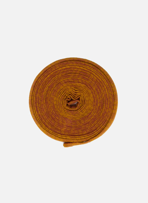 Orange Cotton Ribbon rolled up on white background 