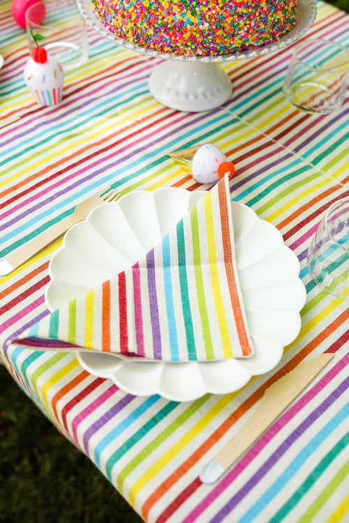 A set of colorful striped kid-sized napkins displayed on a table.