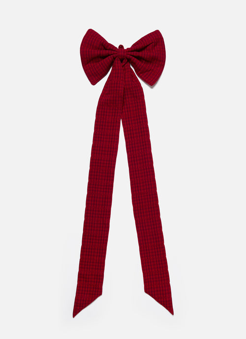 Red checkered bow on a white background