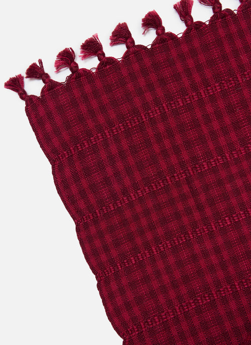 Red/Purple Tablecloth with tassels on a white background