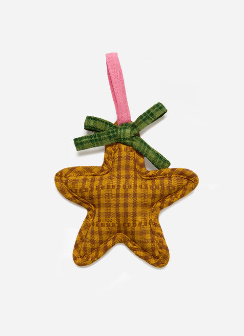Star-shaped fabric ornament with a green bow and pink ribbon on a white background